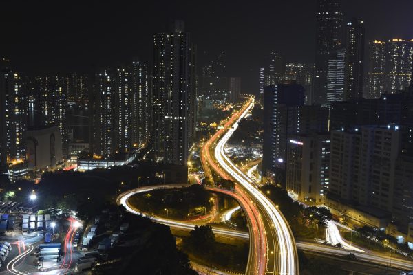 Hong Kong city aerial view at night with traffic patterns
