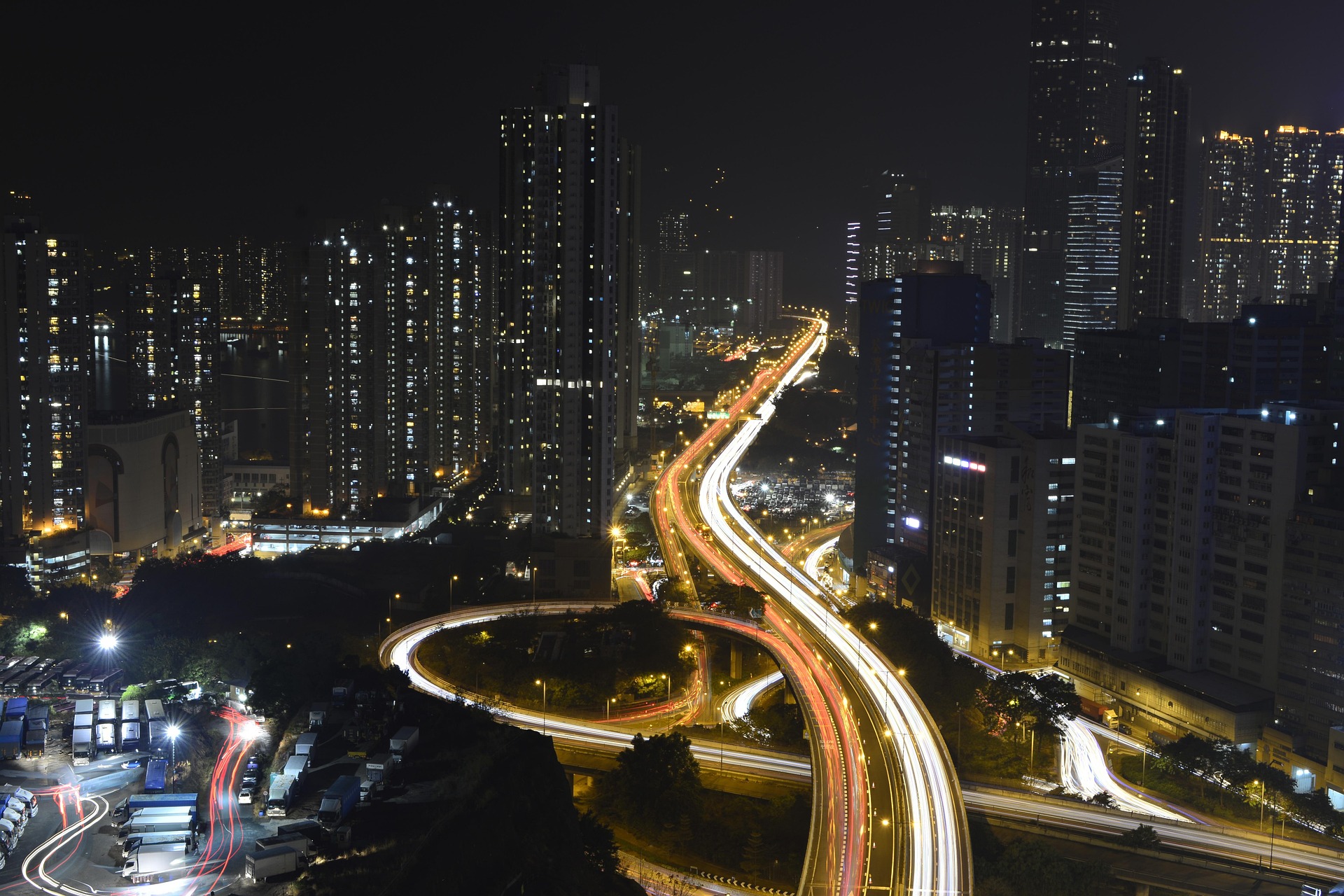 Hong Kong city aerial view at night with traffic patterns
