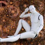 Japanese white robot sitting posing for photo