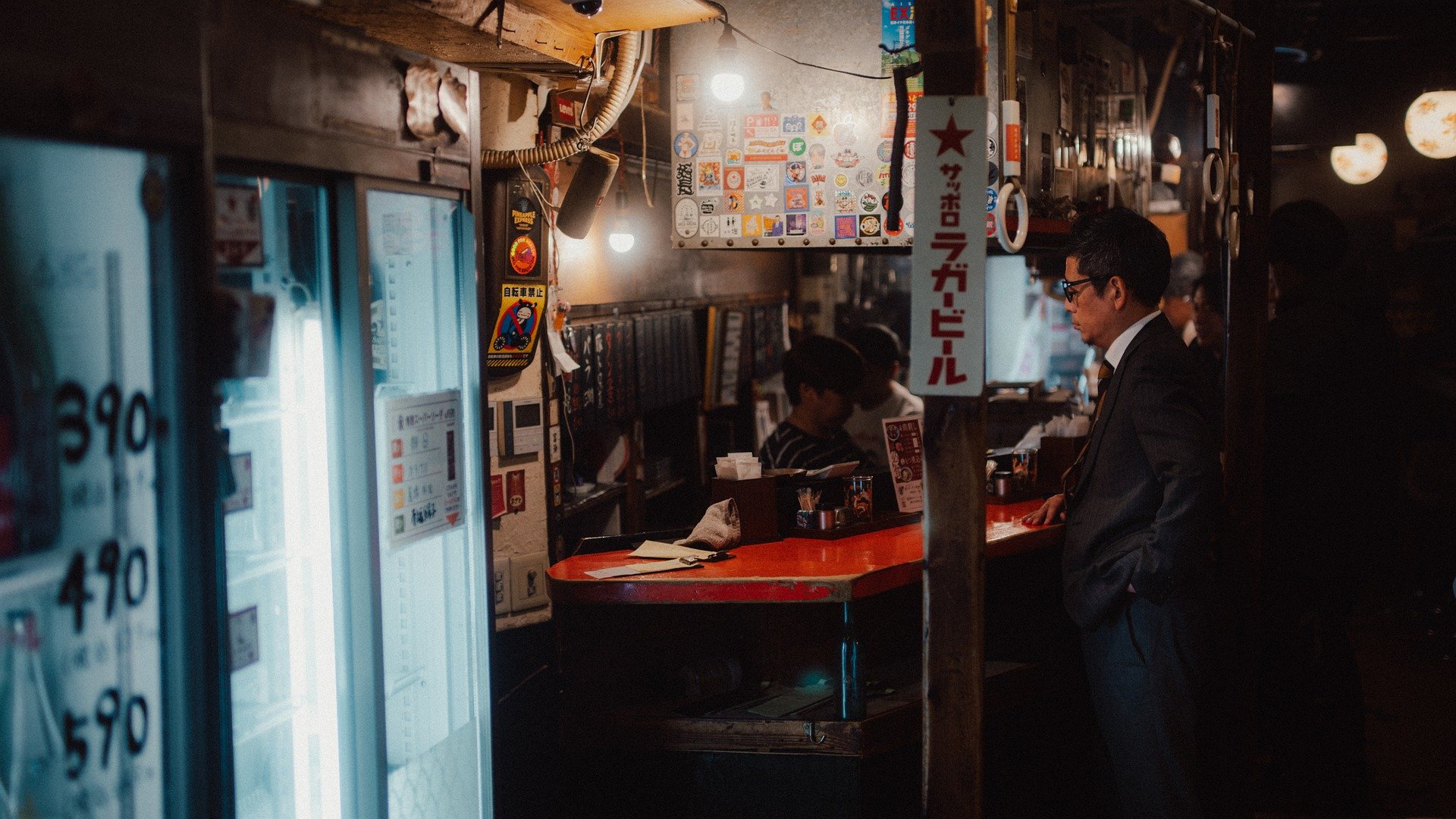 Osaka Japan market at night man paying