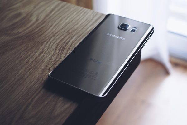 Samsung Galaxy phone face down on desk