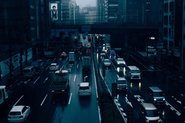 Tokyo highway traffic in evening with wet roads