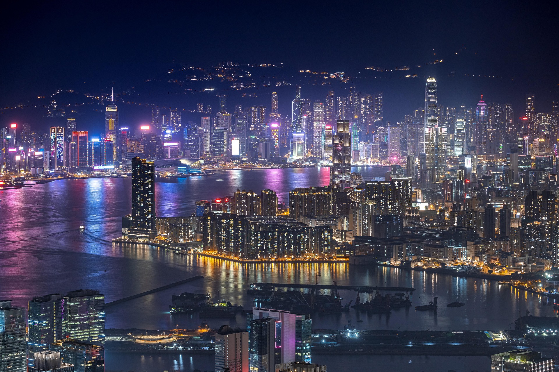 hong kong office buildings skyline in distance at night