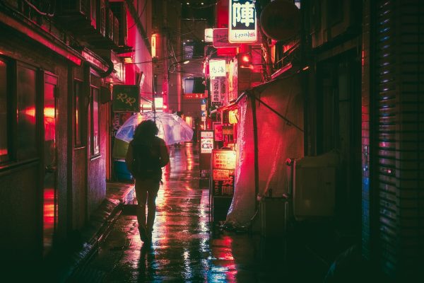masashiwakui-japan-man walking down dark road while raining